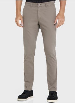 Buy Men Grey Solid Mid-Rise Regular Trousers in Saudi Arabia