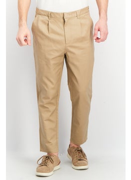 Buy Men Carrot Fit Stretchable Solid Chino Pants, Beige in UAE