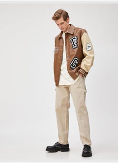 Buy Varsity Jacket Faux Leather Embroidered Snap Buttoned Classic Neck in UAE