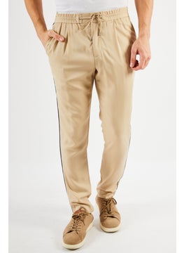 Buy Men Regular Fit Solid Casual Pants, Beige in Saudi Arabia