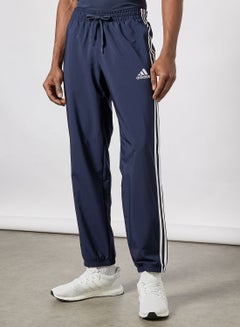 Buy 3-Stripes Essentials Tapered Pants in UAE