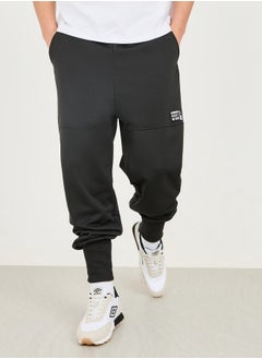 اشتري Badge Detail Extra Wide Rib Cuff Low Rise Joggers في السعودية