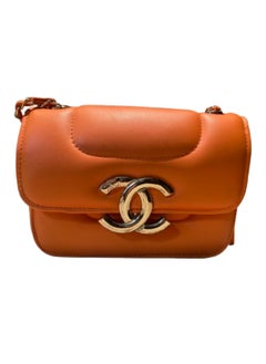 Buy Luxurious women's leather bag, orange color, with a golden metal handle in Egypt