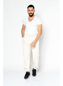 اشتري Men Sportwear Fit Plain Training Jogger Pants, Cream في الامارات