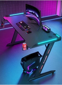 Buy Premium Gaming Desk with RGB LED Lights, E-Sports Computer Desk with Carbon Fiber Surface, Cup Holder and Headphone Hook, Home Gaming Desk with RGB Atmosphere Lighting 140 cm in UAE