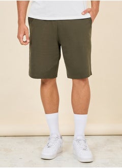 Buy Oversized Solid Shorts with Drawstring Waistband in Saudi Arabia