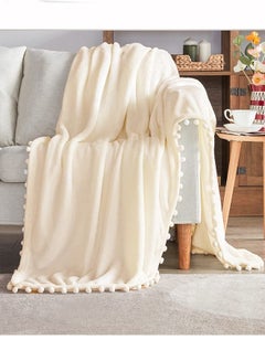 Buy Super Soft Cozy Lightweight Throw Blanket with Pompom Fringe for Couch or Bed Cream White 130x150cm in Saudi Arabia