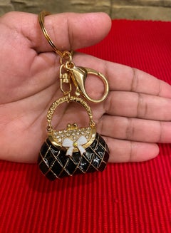 Buy Gold & Black Bag Keychain in Saudi Arabia