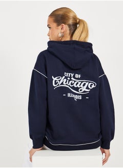 اشتري Oversized Longline  Slogan Hoodie with Contrast Stitch في السعودية