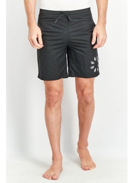 Buy Men Sportswear Fit Adicolor Shattered Trefoil Swim Shorts, black in Saudi Arabia