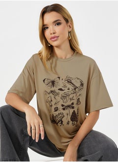 Buy Oversized Graphic Print Round Neck T-shirt in Saudi Arabia