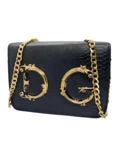 Buy Luxury women's leather bag, black color, with a golden metal handle in Egypt