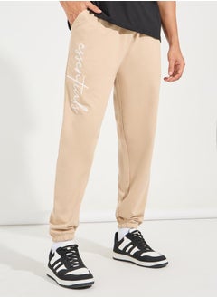 Buy Slogan Print Oversized Fit Jogger with Slip Pocket in Saudi Arabia