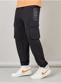 Buy Graphic Print Oversized Cargo Joggers in Saudi Arabia