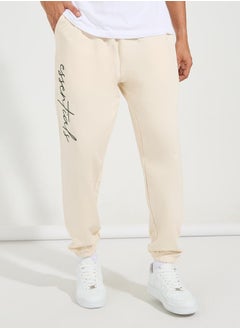 Buy Slogan Print Oversized Fit Jogger with Slip Pocket in Saudi Arabia