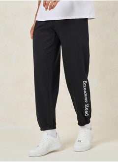 اشتري Relaxed Fit Cotton Terry Joggers with Bottom Hem Print في السعودية