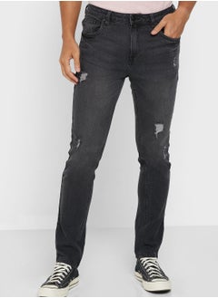 Buy Rip And Repair Tapered Fit Jeans in UAE