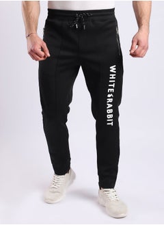 Buy Thigh To Knee Printed "Whte Rabbit" Sweatpants - Black in Egypt