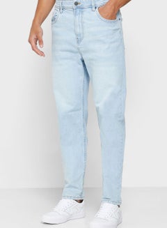 Buy Relaxed Fit Tapered Jeans in Saudi Arabia