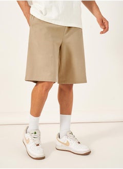 Buy Oversized Solid Shorts with Drawstring in Saudi Arabia