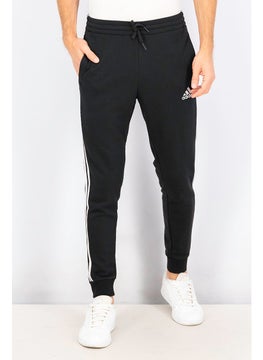 اشتري Men Essentials French Terry Tapered Cuff 3,Stripes Pants, Black and  White في الامارات