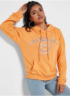 Buy Slogan Hoodie With Glitter Print in Saudi Arabia