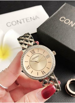 Buy Women's classic cubic zirconia fashionable quartz watch with gold dial and gold stainless steel strap gift 36mm in UAE