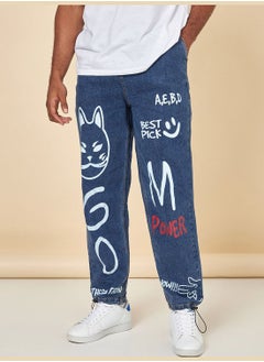 اشتري Grafitti Print Baggy Fit Mid Wash Jeans في السعودية