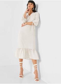 Buy Ruffle Hem Tie Detail Dress in UAE