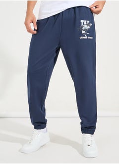 Buy Taz Graphic print Oversized Terry Jogger in Saudi Arabia