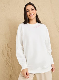 Buy Regular Fit Longline Slogan Embroidered Sweatshirt in Saudi Arabia