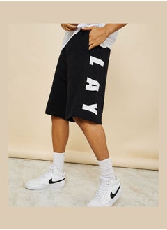 Buy Oversized Terry Shorts with Bold Text Print Detail in Saudi Arabia