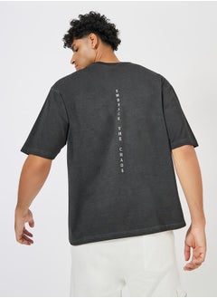 اشتري Overdyed Washed Oversized T-Shirt with Minimal Back Print في السعودية