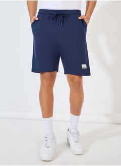 Buy Badge Detail Regular Fit Terry Shorts in Saudi Arabia