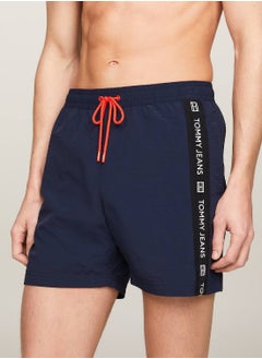 Buy Men's Logo Tape Mid Length Slim Swim Trunks - Nylon, Blue in UAE