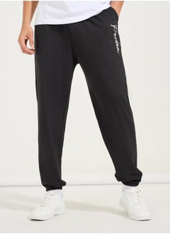 Buy Oversized Text Print Joggers in Saudi Arabia