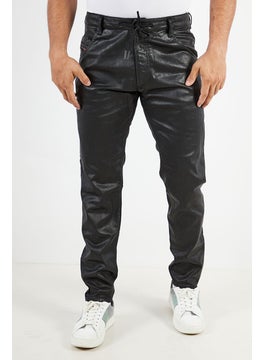 Buy Men Tapered Fit Solid Stretchable Jeans, Black in UAE