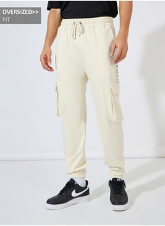 Buy Graphic Print Oversized Cargo Joggers in Saudi Arabia