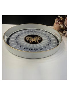 Buy A round serving tray with a golden edge with a butterfly motif, thanks to its classic elegant design. in Saudi Arabia