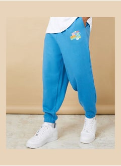 Buy Oversized Graphic Badge Print Jogger in Saudi Arabia