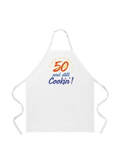 اشتري مريلة مطبوع عليها عبارة "50 And Still Cookin" أبيض/ أزرق/ بني 34x27بوصة في مصر