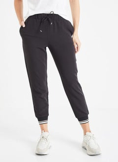 Buy Loose Fitted Trousers Black in Saudi Arabia