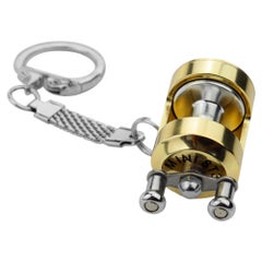 اشتري سلسلة مفاتيح على شكل بكرة صيد ذهبية صغيرة بتصميم محمول 4سم في الامارات