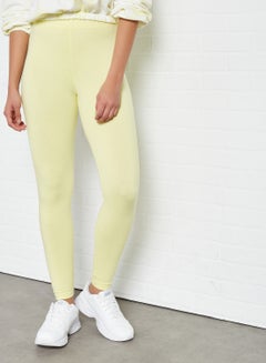 Buy Elastic Waist High-Rise Skinny Fit Plain Leggings Yellow in Saudi Arabia