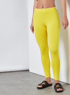 Buy Elastic Waist Mid-Rise Skinny Fit Plain Leggings Yellow in Saudi Arabia