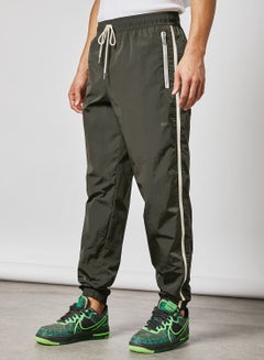 Buy NSW Woven Track Pants Green in Saudi Arabia