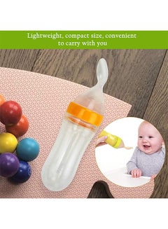 Buy Leak-proof Food Dispensing Silicone Baby Feeding Bottle and Spoon, Yellow/Clear in Saudi Arabia
