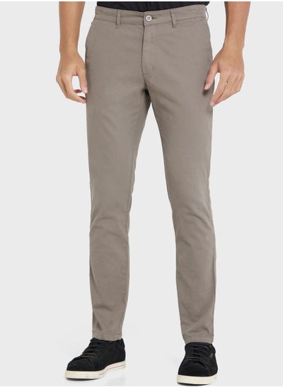 Buy Men Grey Solid Mid-Rise Regular Trousers in Saudi Arabia