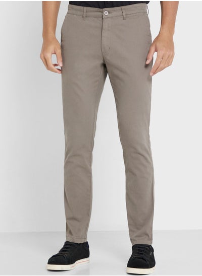 Buy Men Grey Solid Mid-Rise Regular Trousers in UAE