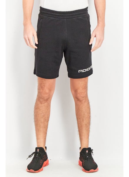 Buy Men Sportswear Fit Symbol Graphic Shorts, Black in UAE